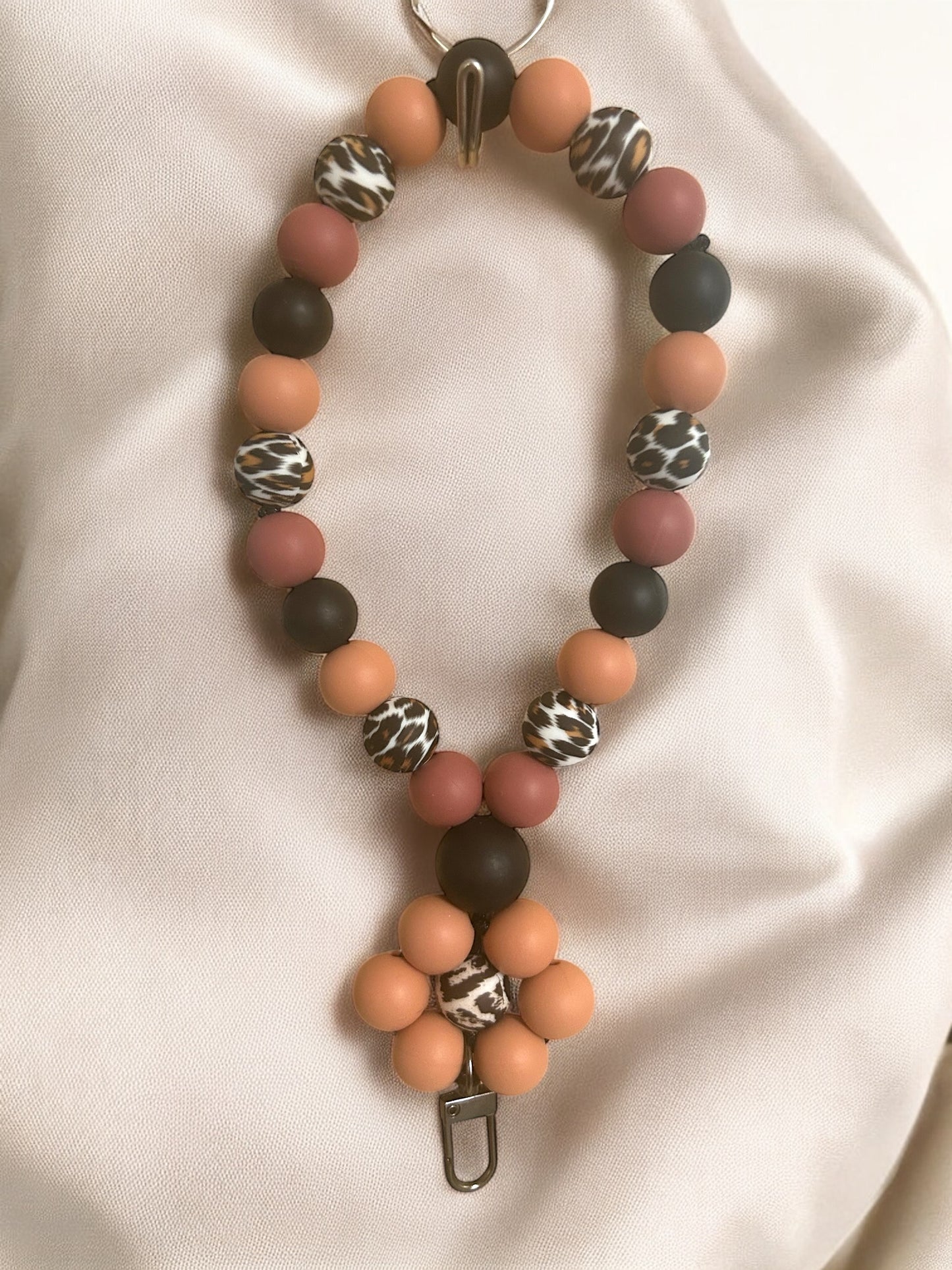 Phone Holders, Wristlets, Backpack & Locker Charms